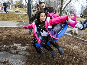 Feeling the breeze is Berlin with her dad Hamid and sister Rio on his lap. Mila swings at the back. The Nafar family enjoying the windy weather on Sunday, March 6, 2022.