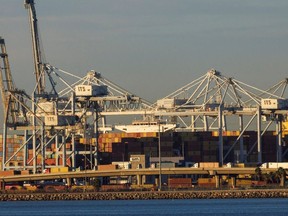 Container trucks , ships and cranes are shown at the Port of Long Beach as supply chain problem continue from Long Beach, California, U.S. November 22, 2021.