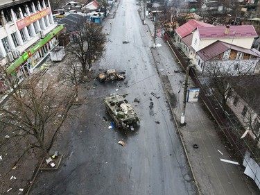 A destroyed armoured vehicle is seen on a street in the settlement of Borodyanka, as Russia's invasion of Ukraine continues, in the Kyiv region, March 3, 2022.