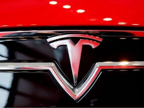 A Tesla logo on a Model S is photographed inside of a Tesla dealership in New York, U.S., April 29, 2016.