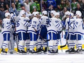 Toronto Maple Leafs players celebrate their team's win over the Dallas Stars on April 7, 2022.