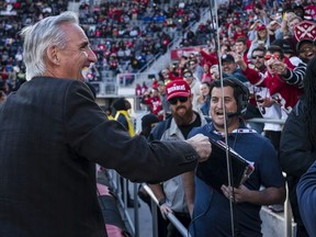 XFL Commissioner Oliver Luck interacts with fans while contributing to the beer cup snake during the second half of the XFL game between the DC Defenders and the St. Louis Battlehawks at Audi Field on March 8, 2020 in Washington, DC.