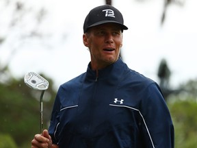 NFL player Tom Brady of the Tampa Bay Buccaneers reacts on the 11th green  during The Match: Champions For Charity at Medalist Golf Club on May 24, 2020 in Hobe Sound, Florida.