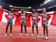 Aaron Brown of Canada, Jerome Blake of Canada, Brendon Rodney of Canada, and Andre De Grasse of Canada celebrates after winning bronze in the Men's 4 x 100m Relay Final during Olympic Games Day 14 at Olympic Stadium on August 6, 2021 in Tokyo, Japan.