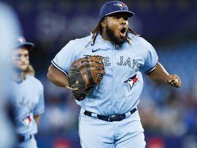 Vladimir Guerrero Jr. of the Toronto Blue Jays reacts to an overturned call in their favour during the seventh inning of their MLB game against the Oakland Athletics at Rogers Centre on April 17, 2022 in Toronto, Canada.