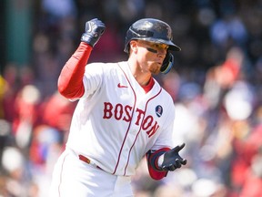 Christian Vazquez #7 of the Boston Red Sox reacts after hitting a solo home run in the seventh inning against the Minnesota Twins at Fenway Park on April 18, 2022 in Boston, Massachusetts.