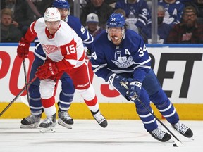 Auston Matthews of the Toronto Maple Leafs controls the puck against the Detroit Red Wings during an NHL game at Scotiabank Arena on April 26, 2022 in Toronto, Ontario, Canada.