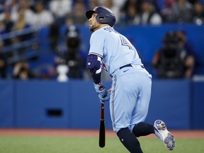 George Springer of the Toronto Blue Jays hits a solo home run in the first inning of their MLB game against the Houston Astros at Rogers Centre on April 30, 2022 in Toronto, Canada.