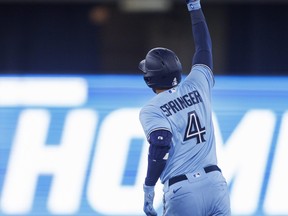 George Springer #4 of the Toronto Blue Jays runs out a solo home run in the third inning of their MLB game against the Houston Astros at Rogers Centre on April 30, 2022 in Toronto.