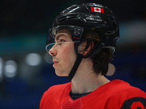 Owen Power of Team Canada looks on during the third period of the Men's Ice Hockey Preliminary Round Group A match between Team Canada and Team United States on Day 8 of the Beijing 2022 Winter Olympic Games at National Indoor Stadium on February 12, 2022 in Beijing, China.