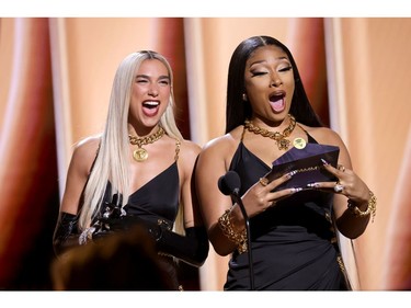 LAS VEGAS, NEVADA - APRIL 03: (L-R) Dua Lipa and Megan Thee Stallion speak onstage during the 64th Annual GRAMMY Awards at MGM Grand Garden Arena on April 03, 2022 in Las Vegas, Nevada.