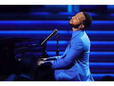 LAS VEGAS, NEVADA - APRIL 03: John Legend performs onstage during the 64th Annual GRAMMY Awards at MGM Grand Garden Arena on April 03, 2022 in Las Vegas, Nevada.