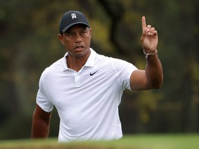Tiger Woods gestures during a practice round prior to the Masters at Augusta National Golf Club on Wednesday.