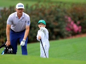 Mackenzie Hughes of Canada and son during the Par Three Contest prior to the Masters at Augusta National Golf Club on Wednesday.