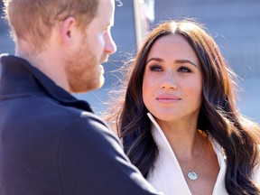 Prince Harry, Duke of Sussex and Meghan, Duchess of Sussex attend the Athletics Competition during day two of the Invictus Games The Hague 2020 at Zuiderpark on April 17, 2022 in The Hague, Netherlands.