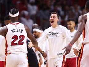 Duncan Robinson #55 of the Miami Heat celebrates with Jimmy Butler #22 during the second half in Game One of the Eastern Conference First Round at FTX Arena on April 17, 2022 in Miami, Florida.