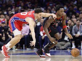 Georges Niang #20 of the Philadelphia 76ers and OG Anunoby #3 of the Toronto Raptors chase a loose ball during the third quarter during Game Two of the Eastern Conference First Round at Wells Fargo Center on April 18, 2022 in Philadelphia, Pennsylvania.