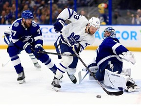 Andrei Vasilevskiy #88 of the Tampa Bay Lightning stops a shot from Kyle Clifford #43 of the Toronto Maple Leafs in the first period during a game  at Amalie Arena on April 21, 2022 in Tampa, Florida.