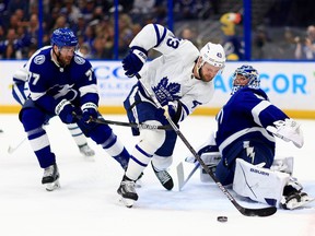 Andrei Vasilevskiy of the Tampa Bay Lightning stops a shot from Kyle Clifford of the Toronto Maple Leafs in the first period during a game  at Amalie Arena on April 21, 2022 in Tampa, Florida.