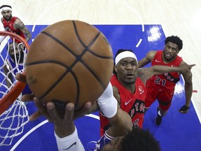 Precious Achiuwa of the Toronto Raptors blocks Matisse Thybulle of the Philadelphia 76ers in the first quarter during Game Five of the Eastern Conference First Round at Wells Fargo Center on April 25, 2022 in Philadelphia, Pennsylvania.