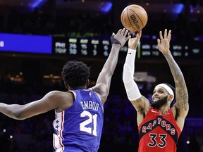 Gary Trent Jr. #33 of the Toronto Raptors shoots over Joel Embiid #21 of the Philadelphia 76ers in the third quarter during Game Five of the Eastern Conference First Round at Wells Fargo Center on April 25, 2022 in Philadelphia, Pennsylvania.