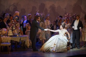 (foreground) Robert Gleadow as Dr. Grenvil and Ekaterina Siurina as Violetta in the COC's production of La Traviata, 2015. Conductor Marco Guidarini, director Arin Arbus, set designer Riccardo Hernandez, costume designer Cait O'Connor and lighting designer Marcus Doshi .Photo: Michael Cooper/Michael Cooper Photographic