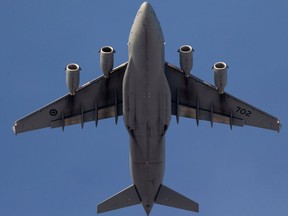 A Royal Canadian Air Force C-177 Globemaster III plane flies over Edmonton last December.