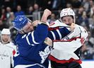 Maple Leafs forward Kyle Clifford (43) fights with Washington Capitals forward Tom Wilson (43) in the second period at Scotiabank Arena. 