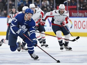 Maple Leafs forward Pierre Engvall brings the puck up ice against the Washington Capitals in the second period of their April 14 game at Scotiabank Arena.