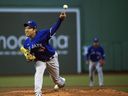 Blue Jays starting pitcher Yusei Kikuchi (16) throws in the first inning against the Boston Red Sox at Fenway Park. 
