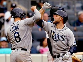 Tampa Bay Rays designated hitter Austin Meadows (right) is congratulated by Brandon Lowe (8) after hitting a home run against the New York Yankees at Yankee Stadium.