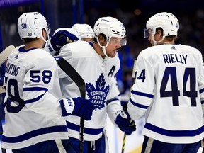 Maple Leafs sniper Auston Matthews is congratulated by teammates after completing his hat trick against the Tampa Bay Lightning on Monday night. Mathews had 54 goals heading into Tuesday night's action.