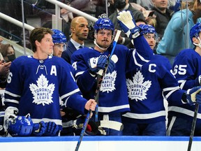 Maple Leafs forward Auston Matthews (middle) acknowledges a tribute by fans after setting a new Maple Leafs single season record for goals during a break in the action against the Montreal Canadiens at Scotiabank Arena on Saturday night.