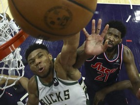Giannis Antetokounmpo (left) of the Bucks and Joel Embiid (right) of the 76ers are two of the three finalists for the NBA MVP award, the league announced Sunday, April 17, 2022.