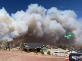 Smoke drifts from the Tunnel Fire north of Flagstaff, Ariz., April 19, 2022 in a still image from video.