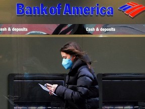 A person walks past a Bank of America sign in the Manhattan borough of New York City, New York, Jan. 19, 2022.