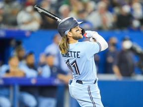 The Blue Jays' Bo Bichette hits a grand slam against the Boston Red Sox in the eighth inning on Monday night at the Rogers Centre.
