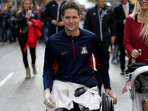 United States Air Force Senior Airman Brian Kolfage Jr., a triple amputee who lost both his legs and an arm while serving his second deployment in Iraq in 2004, attends the Veterans Day parade on 5th Avenue in New York, Nov. 11, 2014.