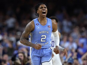 Caleb Love #2 of the North Carolina Tar Heels reacts in the second half of the game against the Duke Blue Devils during the 2022 NCAA Men's Basketball Tournament Final Four semifinal at Caesars Superdome on April 02, 2022 in New Orleans, Louisiana.