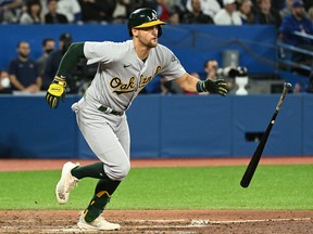 Oakland Athletics left fielder Chad Pinder (10) hits a single against the Toronto Blue Jays at Rogers Centre.