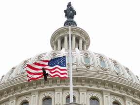 The U.S. flag flies over the U.S. Capitol in Washington, D.C., April 26, 2022.