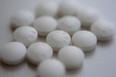 This Aug. 23, 2018 file photo shows an arrangement of aspirin pills in New York.