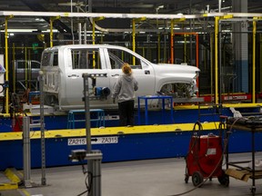 An auto worker is seen at the GM Assembly plant producing the Chevrolet Silverado, in Oshawa on February 22 2022.