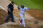 Toronto Blue Jays' Vladimir Guerrero Jr. gestures to fans as he reaches home plate on a home run during the eighth inning of the team's baseball game against the New York Yankees on Wednesday, April 13, 2022, in New York.