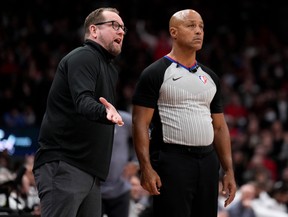 Toronto Raptors head coach Nick Nurse has words with referee Marc Davis during second half NBA first round playoff action against the Philadelphia 76ers in Toronto on Wednesday April 20, 2022. THE CANADIAN PRESS/Nathan Denette