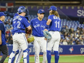 Toronto Blue Jays starting pitcher Yusei Kikuchi (16) is visited at the mound during the second inning of MLB baseball action against the Houston Astros in Toronto on Friday, April 29, 2022.