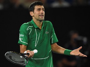 This file photo taken on February 2, 2020 shows Novak Djokovic reacting after a point against Dominic Thiem during the Australian Open in Melbourne.
