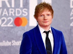 Ed Sheeran poses as he arrives for the Brit Awards at the O2 Arena in London, Feb. 8, 2022.