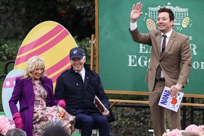 U.S. President Joe Biden and first lady Jill Biden react as television host Jimmy Fallon waves during a reading of books session at the annual Easter Egg Roll on the South Lawn of the White House in Washington, D.C., April 18, 2022.
