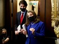 Finance Minister Chrystia Freeland and Prime Minister Justin Trudeau speak to the media before delivering the 2022-23 budget, on Parliament Hill in Ottawa, April 7, 2022.